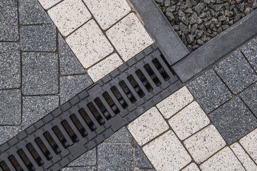 Standing Water in the Yard: French Drain, Catch Basin, or Both?